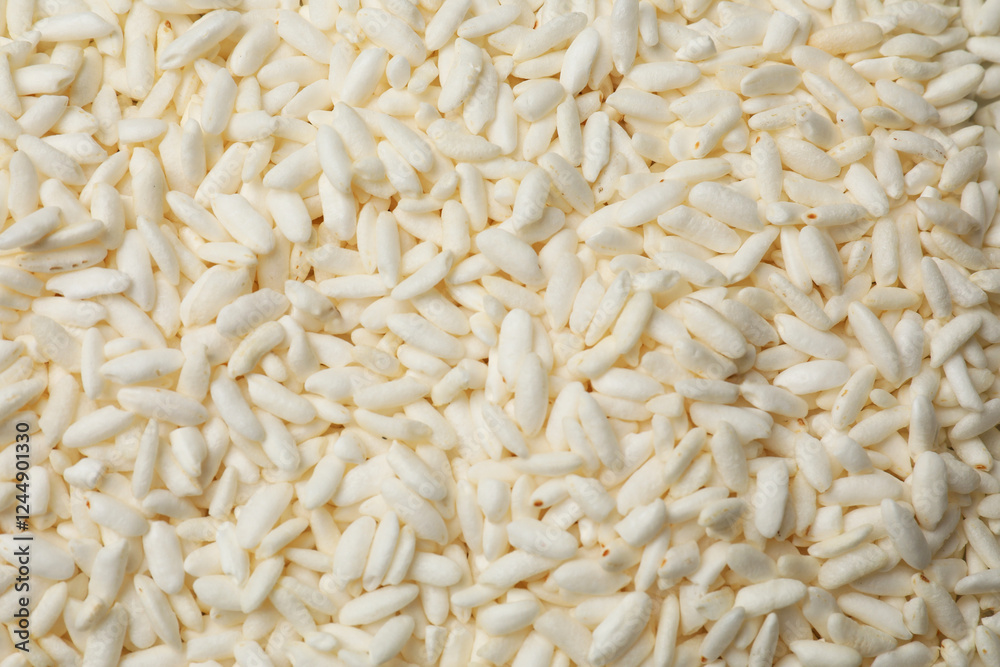 Wholegrain puffed rice as background, closeup view Wholegrain puffed rice as background, closeup view