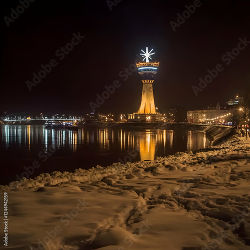 Illuminated Tower Reflects ...