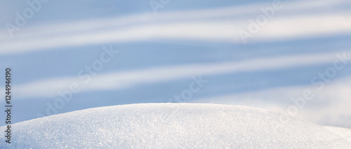 Obraz na płótnie Winter christmas background, banner - view of the snowdrift sparkling in the rays of the winter sun, selective focus w salonie