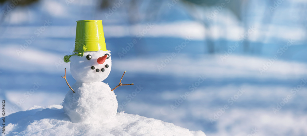 Christmas winter banner with snowman on snow background in winter forest. Holiday background with copy space for text