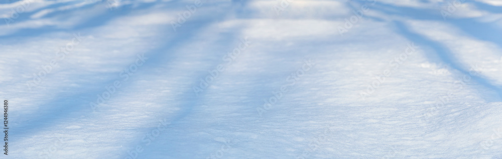 Winter christmas background, banner - view of the snowdrift sparkling in the rays of the winter sun, selective focus