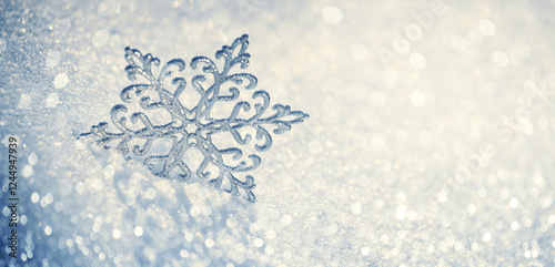 Obraz na płótnie Christmas winter background, banner - view of a decorative snowflake on snow sparkling in the rays of the sun, copy space for text w salonie