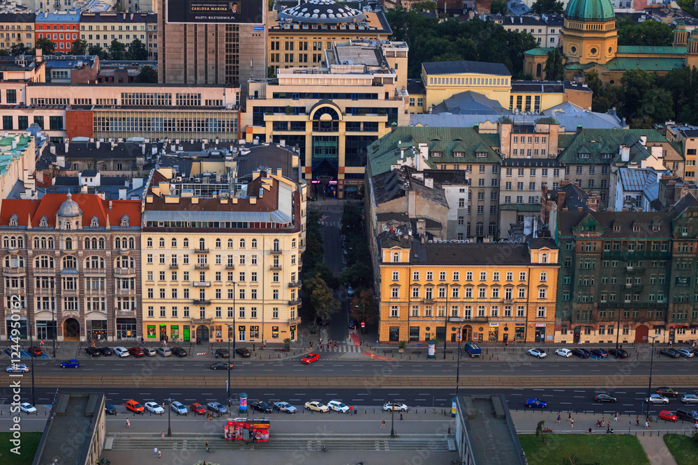Cityscape at sunset - top view of Jerusalem Avenue and neighbourhood of Koszyki, located within the Srodmiescie district in center of Warsaw, Poland