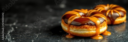 Delicious chocolate and caramel donuts on a marble surface ready to indulge taste buds photo