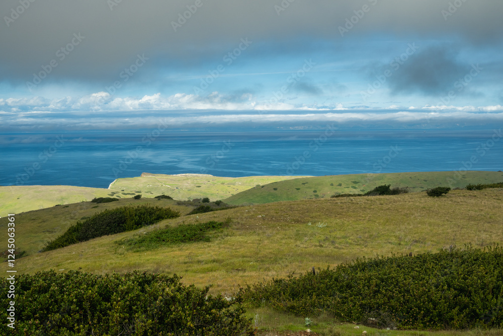 Morning Sunlight Breaks Through The Clouds To Light The Rolling HIlls Of Santa Cruz Island Morning Sunlight Breaks Through The Clouds To Light The Rolling HIlls Of Santa Cruz Island
