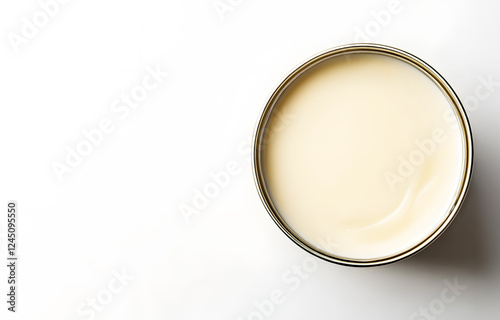 Aluminum can containing condensed milk elegantly designed on white background with light shadow. Emphasizing simplicity and premium quality. Perfect for advertising concepts. copy space for text. photo