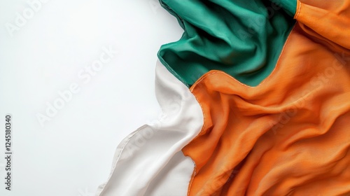 A highly detailed close-up of the Indian flag, showcasing its stitching and fabric texture, laid flat on a plain white background, photo