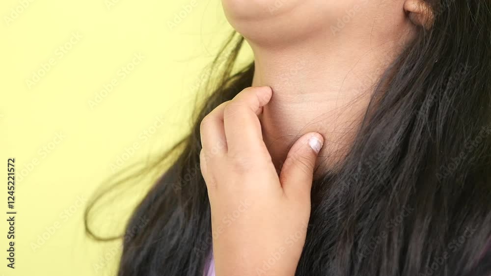 a little girl appears to struggle with a choking feeling while remaining calm. a little girl appears to struggle with a choking feeling while remaining calm.