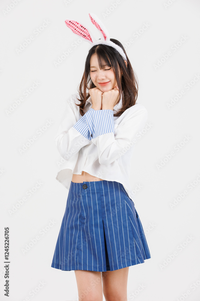 Portrait of happy asian young cute pretty woman wearing  casual clothes bunny rabbit ears, teen girl smiling cheerful fun pose looking at camera on white background, Celebrating easter spring holidays