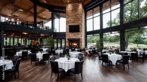 Upscale restaurant interior, golf course view, fireplace, modern design