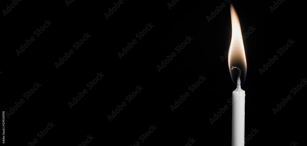 A solitary candle flame flickering in darkness, symbolizing hope, warmth, and tranquility in a serene environment. A solitary candle flame flickering in darkness, symbolizing hope, warmth, and tranquility in a serene environment.