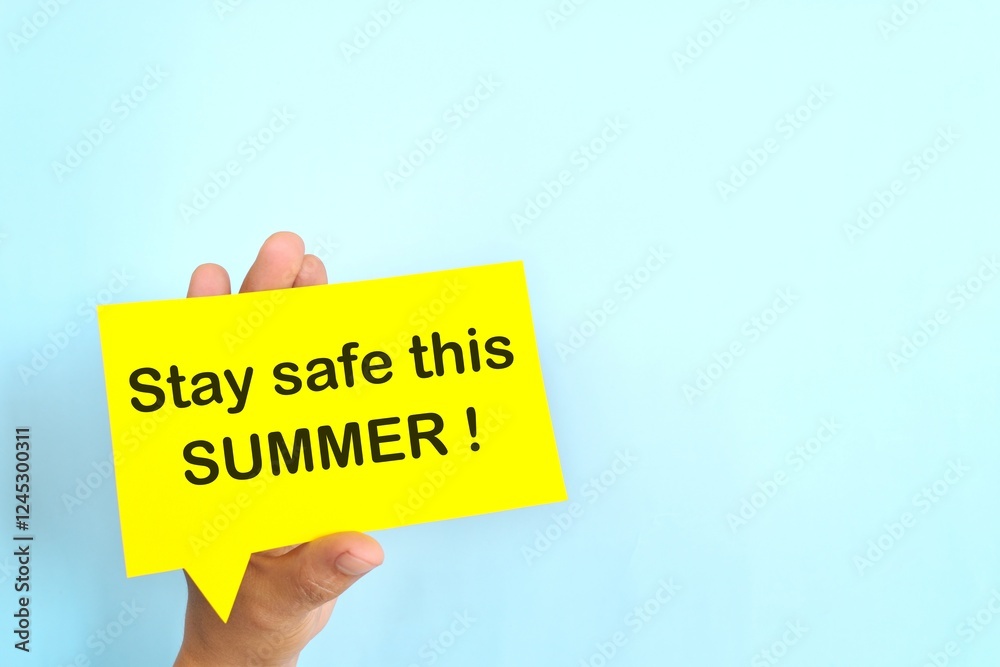 Summer essentials and safety tips reminder concept. Hand holding bright yellow speech bubble in blue background.
