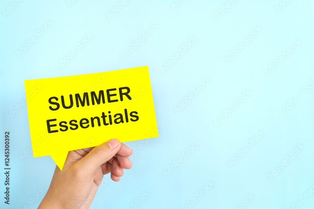Summer essentials and safety tips reminder concept. Hand holding bright yellow speech bubble in blue background.