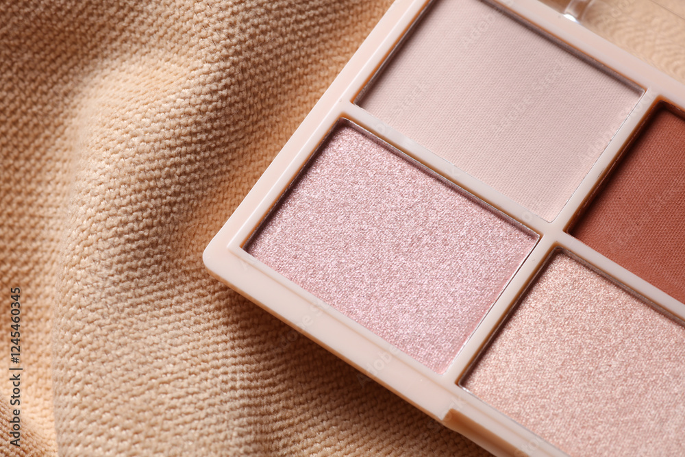 Fototapeta premium Makeup eyeshadow palette on beige velour background