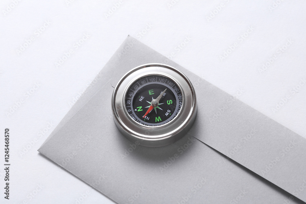 Envelope and compass on white background. Business concept Envelope and compass on white background. Business concept