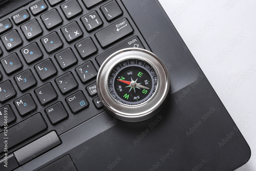 Laptop and compass on white background. Business concept Laptop and compass on white background. Business concept
