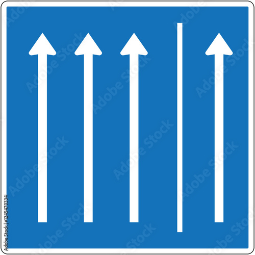 Four lane traffic flowing in designated direction on blue road sign