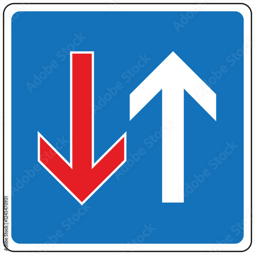 Blue and white priority road sign indicating upward direction of travel has priority over downward direction