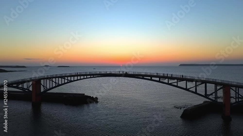 Wallpaper Mural Aerial 4K footage of Xiying Rainbow bridge during sunset in the Penghu island of Taiwan.  Torontodigital.ca