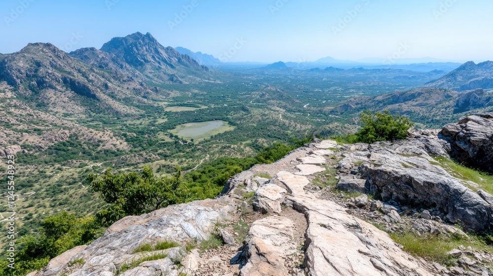 Fototapeta premium Mountaintop path overlooking valley, rural landscape