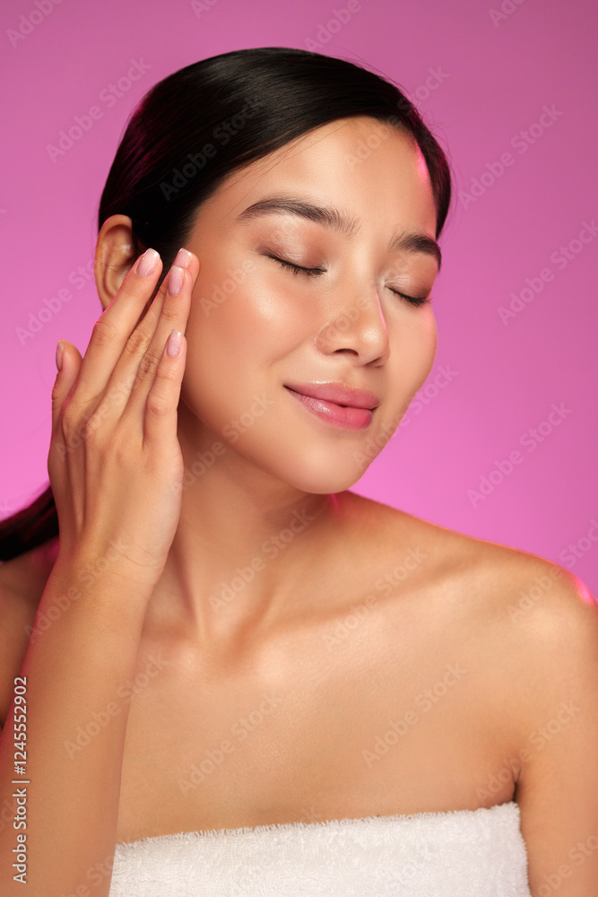 Skin care routine highlights with model applying moisturizer in bright setting Skin care routine highlights with model applying moisturizer in bright setting