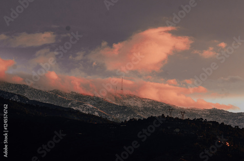 blue hour over a snowy mountain 