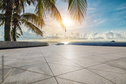 Fototapeta Naklejka Na Ścianę i Meble -  Empty square floor and palm trees with beautiful coastline in summer