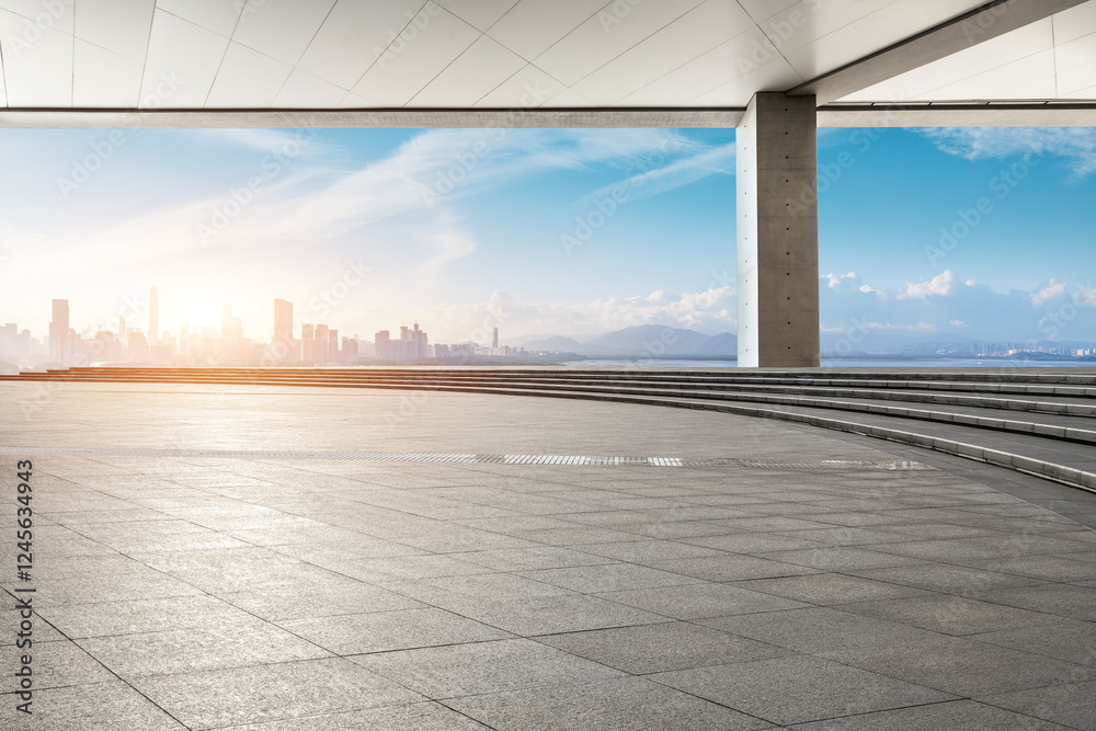 Empty square floor and city skyline in the sunny morning