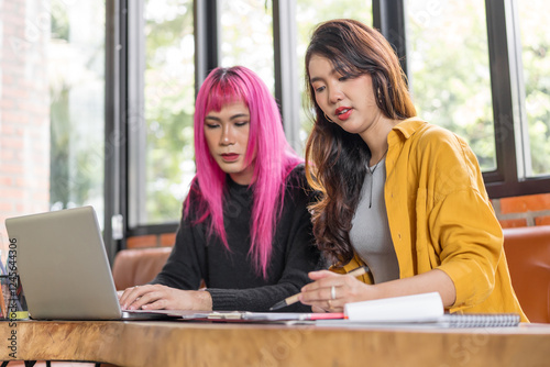 Wallpaper Mural LGBTQ+ transgender man Beautiful Authentic Specialist with Pink Hair and Non-binary trans working together Working Design in creative workplace team work colleagues Gender equality Torontodigital.ca