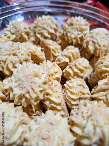 A bowl of sagu keju, cheese butter cookies photo