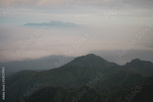 Volcano crater. Hiking. Mount Ruang Volcano Summit with Scenic Mountain View. Indonesia photo