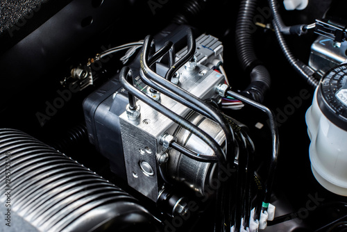 Close up of ABS module in engine bay , Anti lock brake system module of car brake system , automotive parts concept