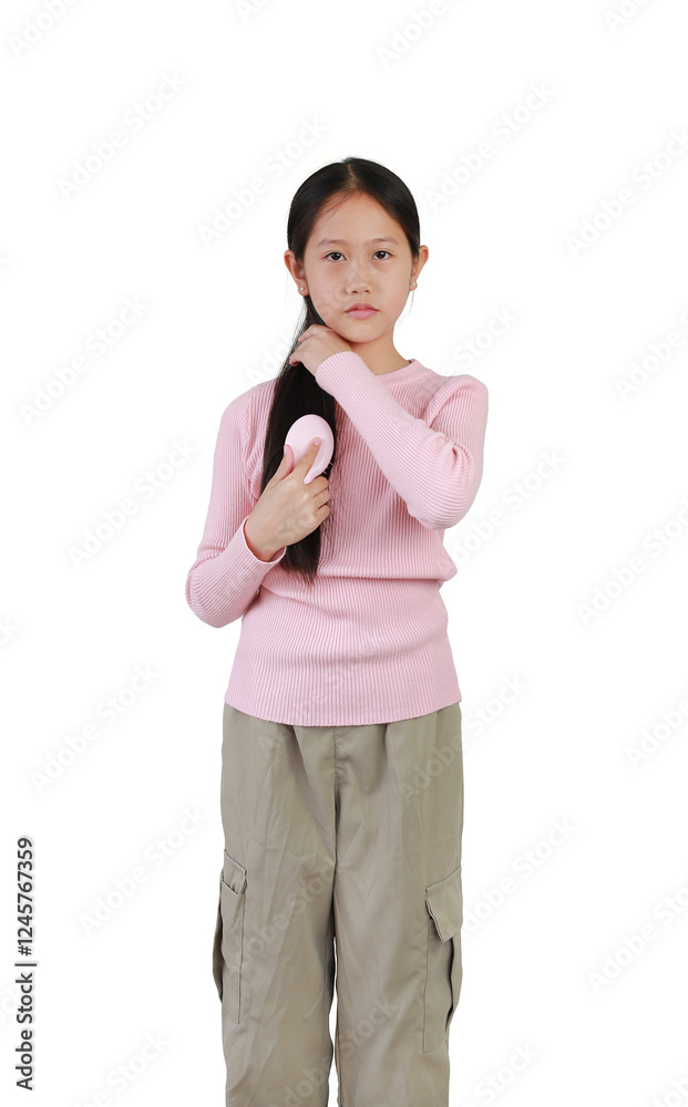 Asian young girl combing long hair isolated on white background. Healthcare concept. Asian young girl combing long hair isolated on white background. Healthcare concept.