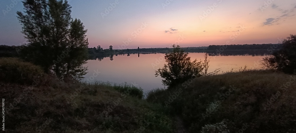 Obraz premium sunset over the river