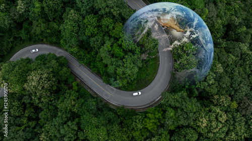 Fototapeta Naklejka Na Ścianę i Meble -  Aerial view EV electric vehicle car on middle green tree forest road globe earth planet, EV car electric vehicle car alternative sustainable energy eco power, Green business ecosystem environment.