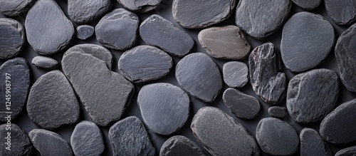 Gray flat stone background with a textured appearance ideal for text overlay or design elements in modern layouts. photo