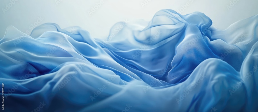 Obraz premium Blue abstract fabric background with smooth flowing waves and gentle gradients for elegant design and artistic compositions