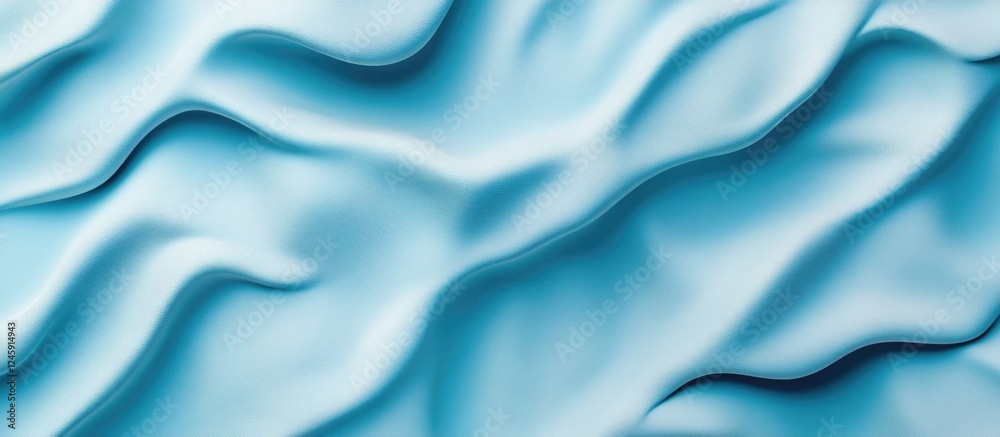 Obraz premium Textured blue fabric background with gentle waves and folds suitable for modern design and wallpapers.