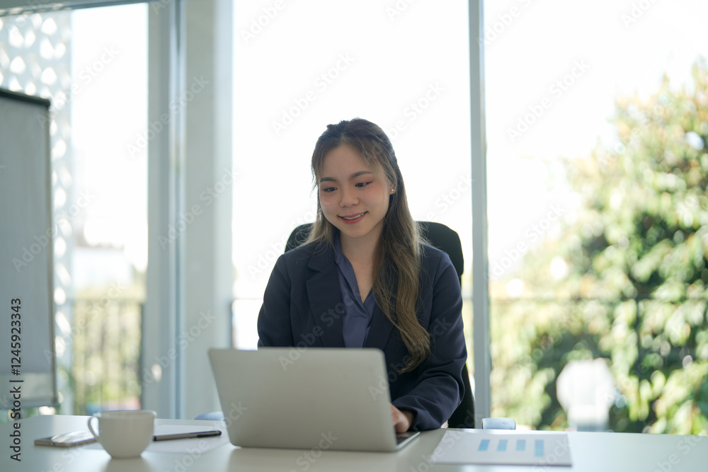 Fototapeta premium Asian female working in workplace happy and mindfulness.