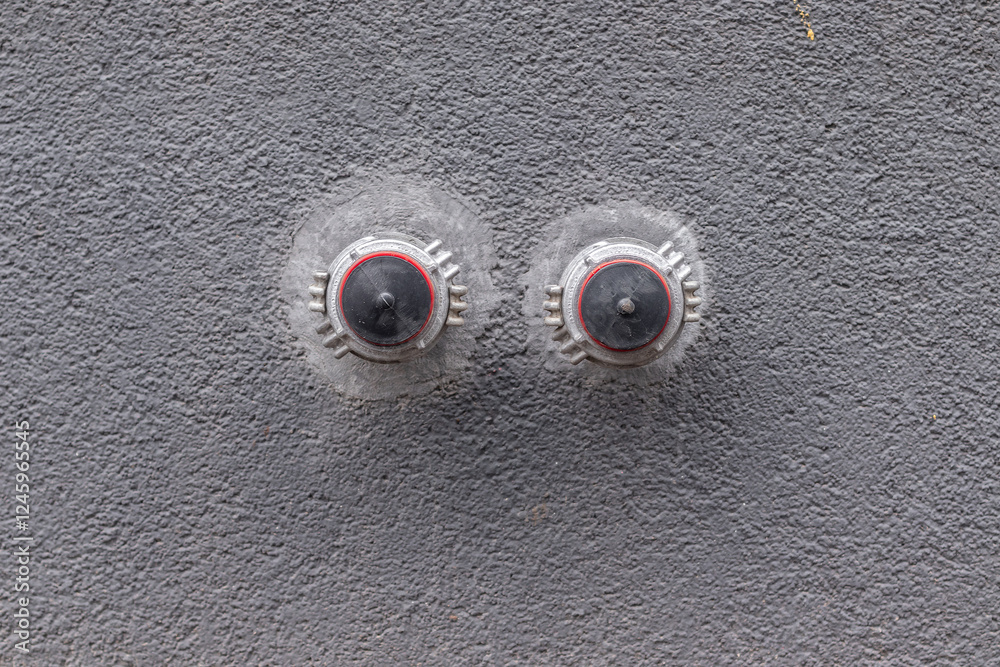 Fire fighting equipment in the wall of the building. Sprinkler system for water supply. Fire fighting equipment in the wall of the building. Sprinkler system for water supply.