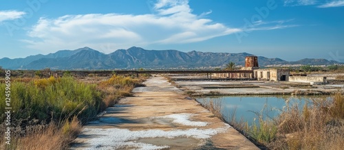 Abandoned saltworks in Calblanque Murcia showcasing historical landscape and natural beauty with mountains in the background