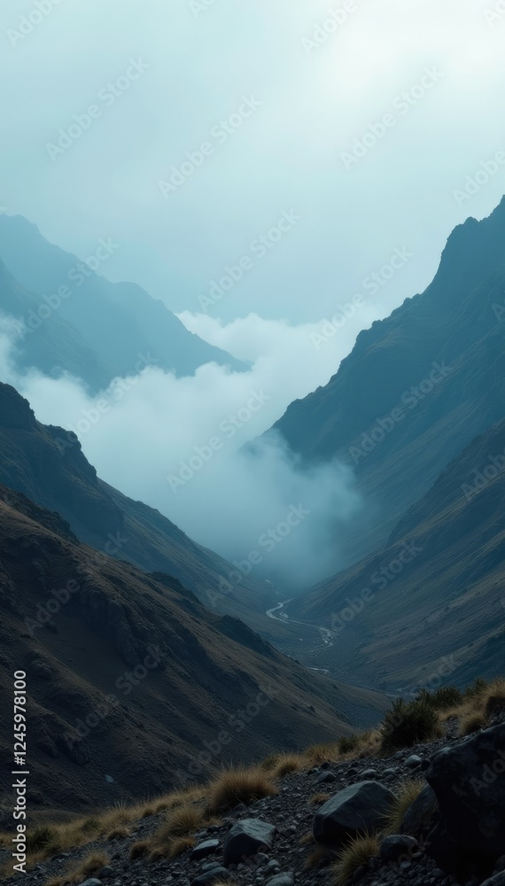 Naklejka premium An otherworldly fog rolls in over a barren landscape, eerie ambiance, foggy valleys, ethereal atmosphere