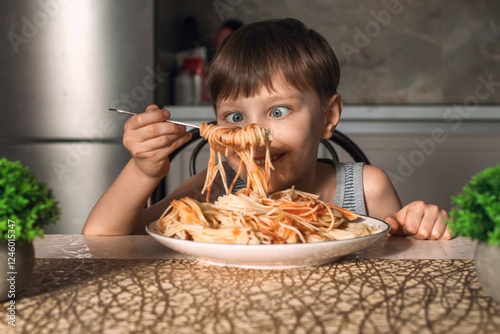 Cute little boy eating spaghetti. Funny life moments