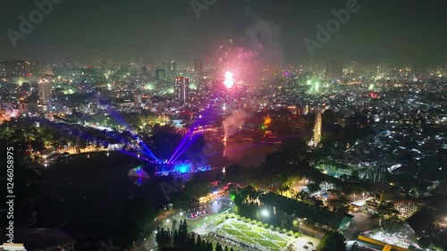 Wallpaper Mural Beautiful aerial view of festive fireworks showing Ho Chi Minh city in Vietnam during Lunar New Year's Eve 2025 with fireworks shooting up and colorful lights on houses. Night celebration Torontodigital.ca