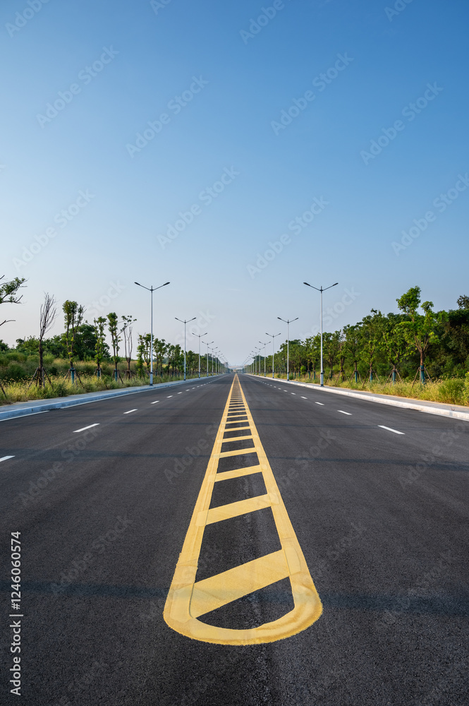 newly constructed asphalt road with yellow centerline, clipping path includes