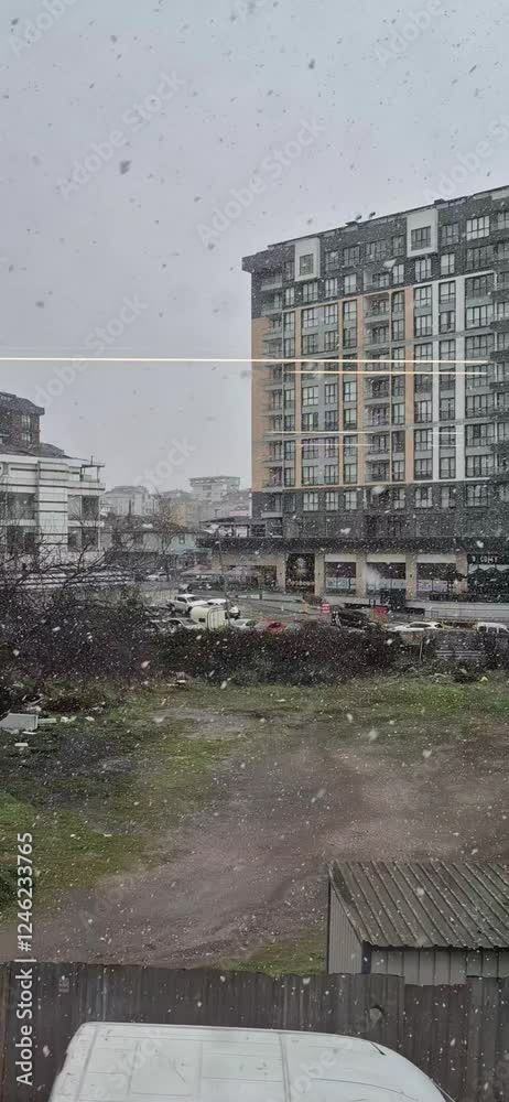 Video of heavy snowfall in Istanbul. Vertical video. storm. Shaking trees and people walking on the road. Video of heavy snowfall in Istanbul. Vertical video. storm. Shaking trees and people walking on the road.