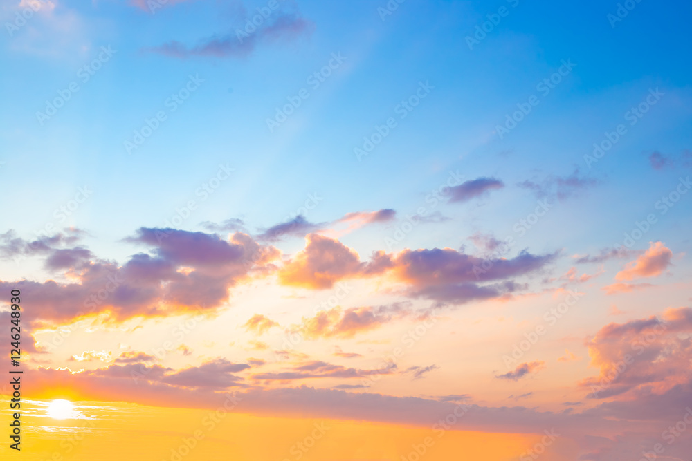 Obraz premium Blue sky with clouds illuminated by the setting sun. Beautiful skyscape
