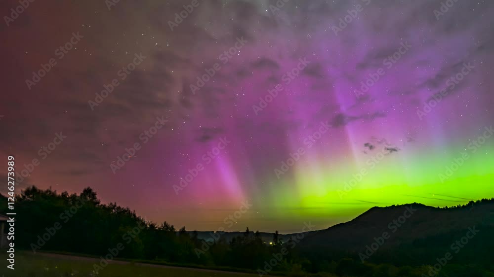 Aurora Borealis over wild mountains and clouds - timelapse Aurora Borealis over wild mountains and clouds - timelapse