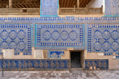 Decorated wall with blue tiles  at Tash Hauli royal palace in Ichan Kala town photo