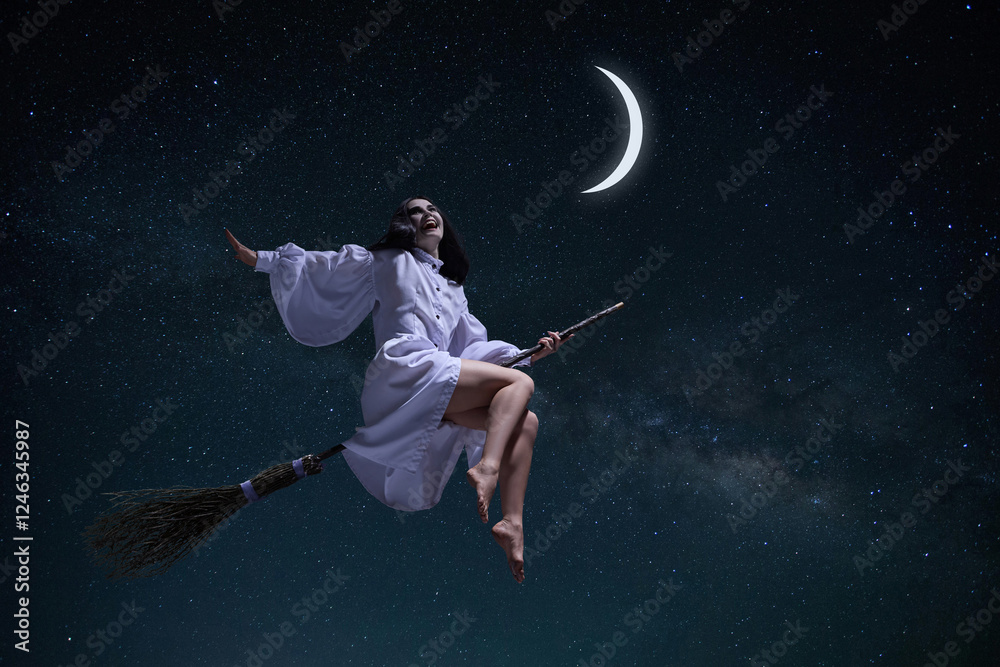 Laughing woman in white gown, mystical witch flying on broomstick with moon and dark night starry sky. Concept of fantasy, magic, mystery, supernatural, fantasy. Book and movie covers ideas Laughing woman in white gown, mystical witch flying on broomstick with moon and dark night starry sky. Concept of fantasy, magic, mystery, supernatural, fantasy. Book and movie covers ideas